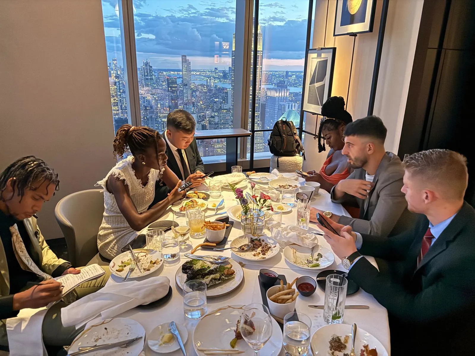 FollowUS team dinner with Manhattan skyline view