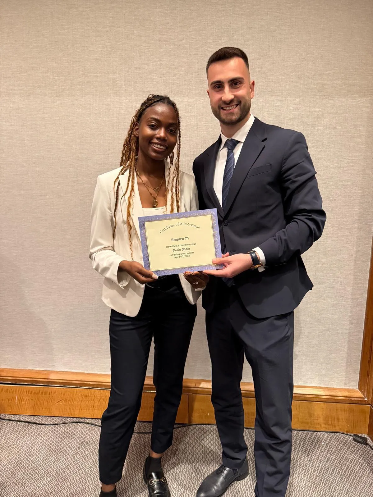 FollowUS team member celebrating success on stage